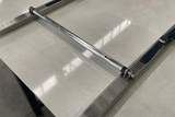 Motorcycle wheel rolling across the Alien Ramp Tailgate Roll Plate