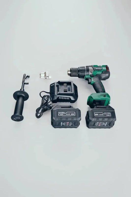 Green Neo-Dyne cordless drill with battery and accessories on a white background