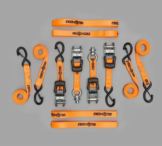 Collection of Neo-Dyne orange straps and ratchet handles with 'Rigging' branding on a gray background